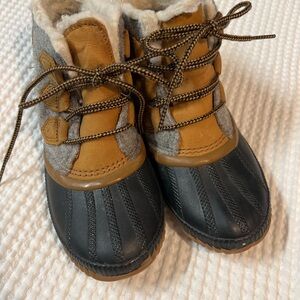 Sorel Women’s Navy/Gray/Tan waterproof boots.